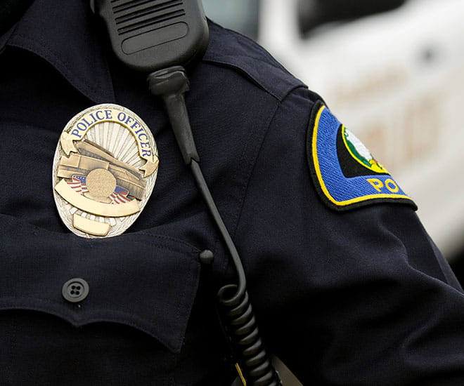 Close up of a police uniform and badge